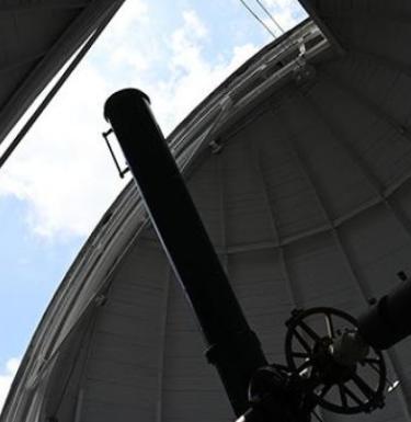 photo of observatory machinery looking to outer space 